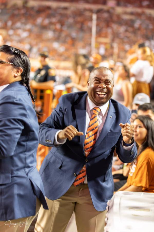 Croomes laughs on the sidelines of the Texas-Rice game on Sept. 18, 2021