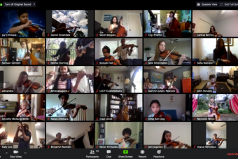 A grid of students playing their violins in a Zoom meeting.