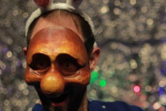 a man wearing a clown mask