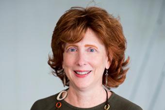 Headshot of Associate Professor Christina Bain in front of a white background