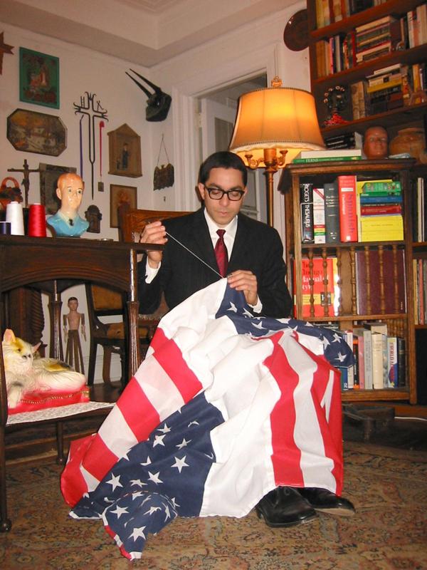 image of Nicolas Estevez sewing a flag for performative piece