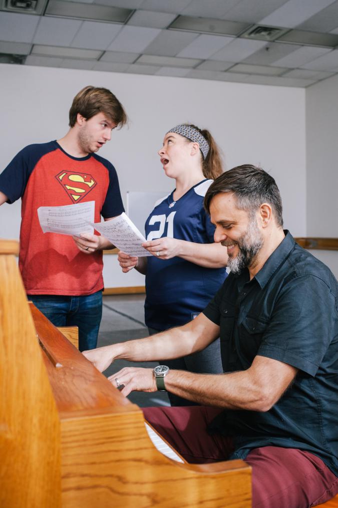 Three students rehearse opera music