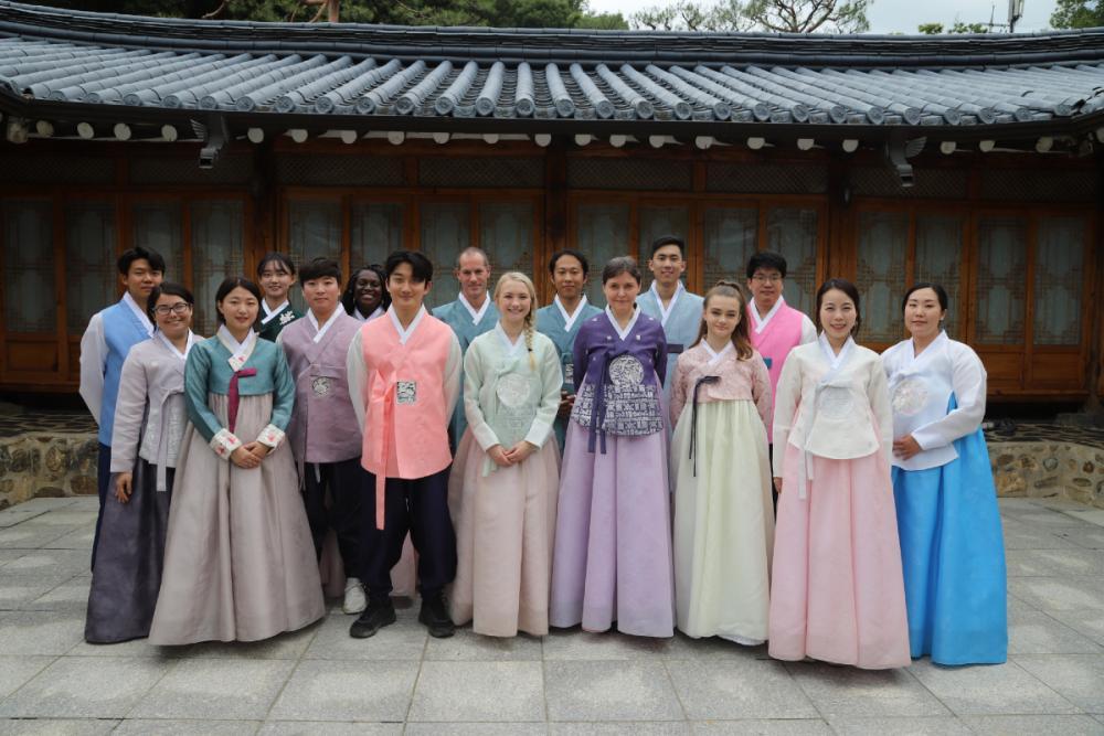 UT and Chung-Ang University students wear traditional hanok clothing while visiting a hanok village in the mountains outside of Seoul.