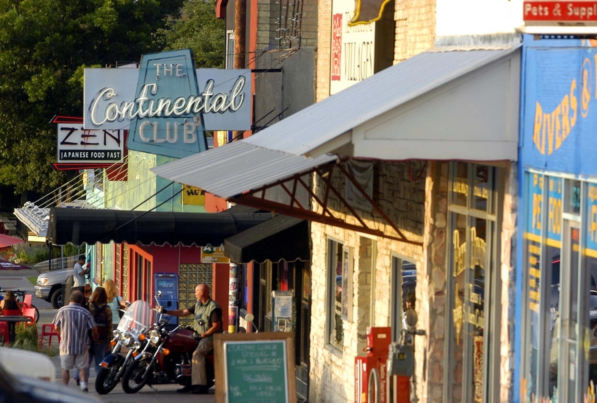 View of The Continental Club sign on South Congress looking north