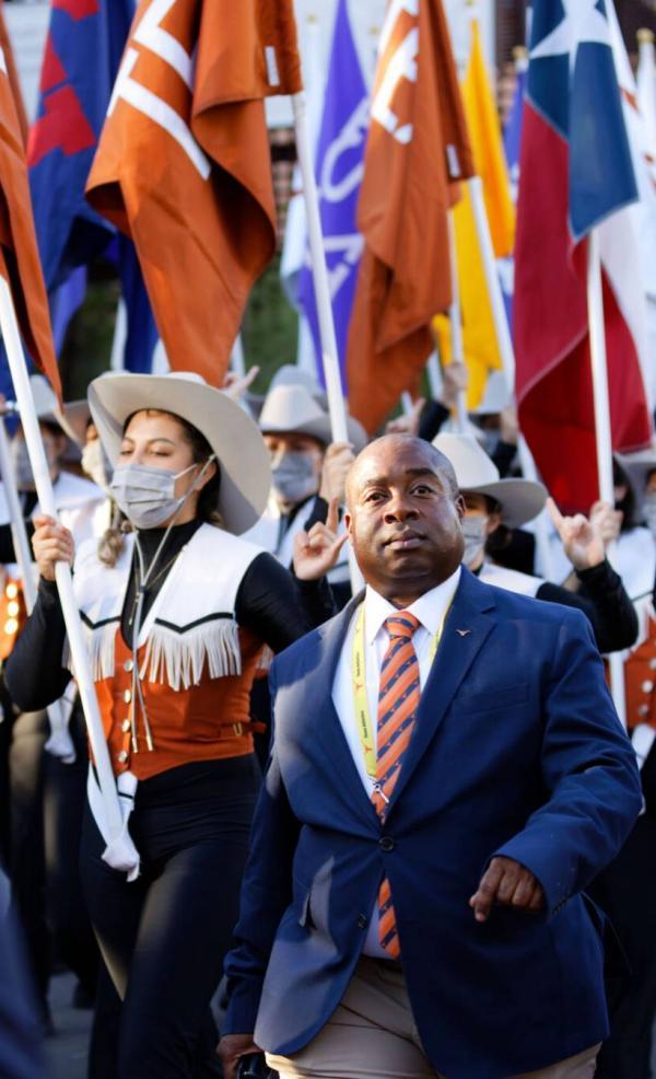 Croomes marches with the Longhorn Band into the stadium for the Texas-Rice game on Sept. 18, 2021