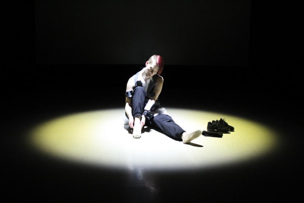Performance image of Kendra S. Wiley's dance piece ERROR 404: Gender Not Found