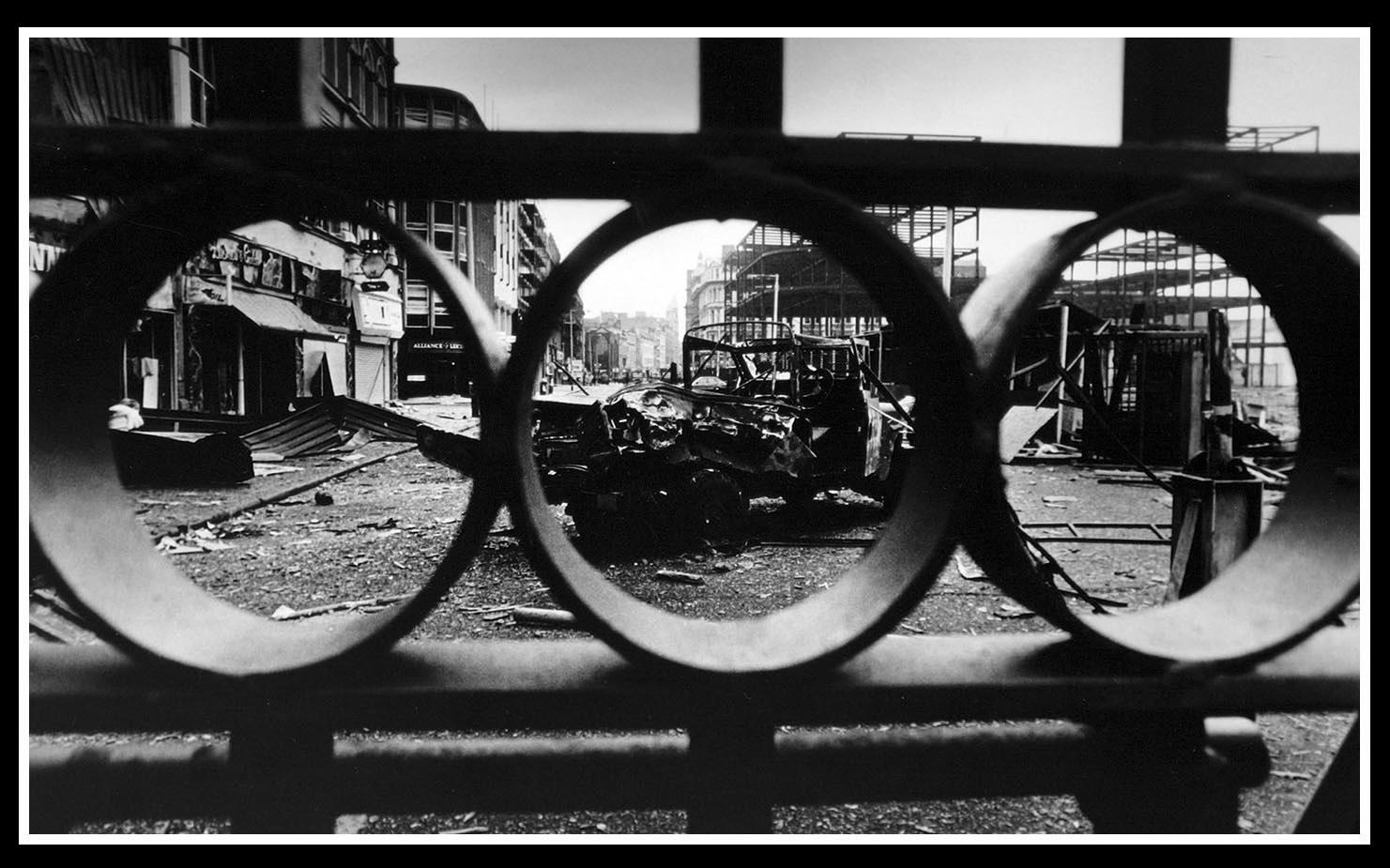The Ring of Steel was a security cordon constructed in Belfast, Ireland during the Troubles Era to keep bombers from entering the city's commercial district. This undated image shows the aftermath of an explosion outside the Royal Avenue checkpoint.