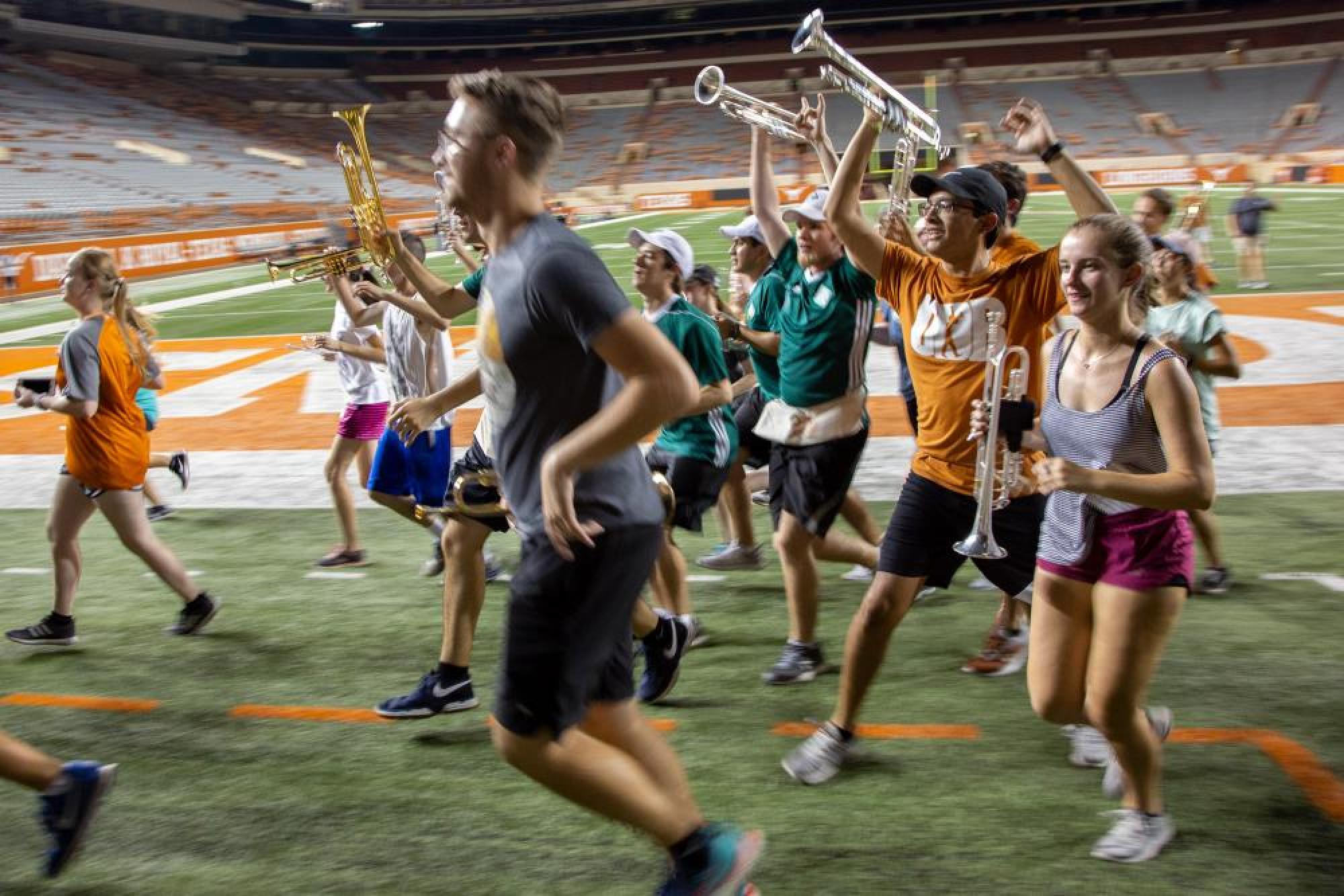 UT Longhorn band celebrating during rehearsal