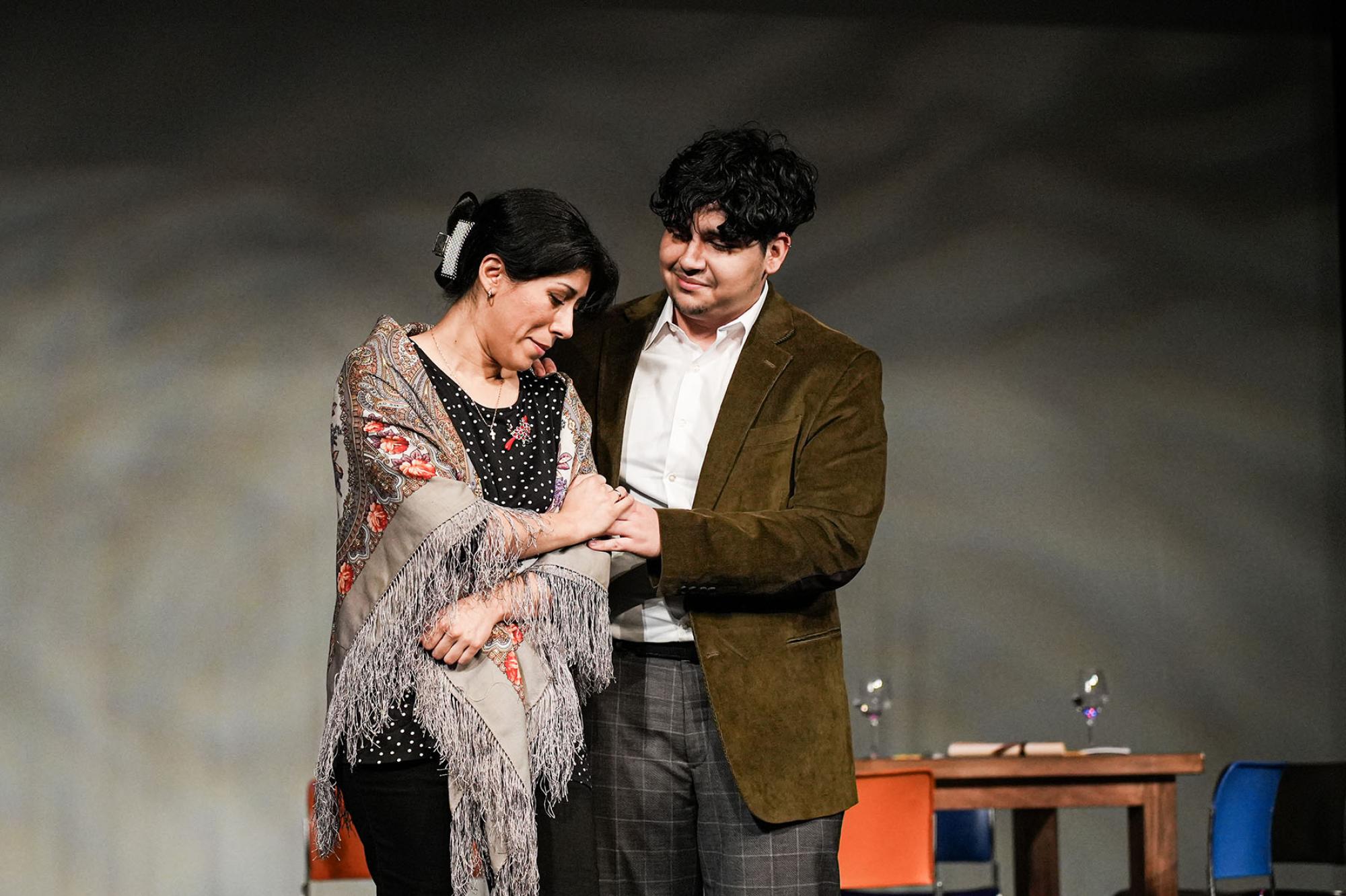 Production still of two singers performing in Josiah Garza's opera "Maria"