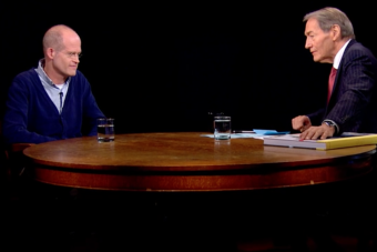 Chris Ware sits across a table from Charlie Rose