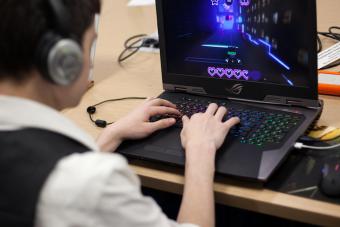 A student plays a game on a laptop computer