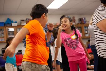 middle school students role-playing in class