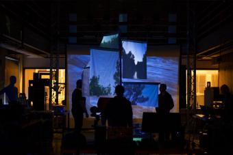Students display a projected exhibition of nature seen through windows