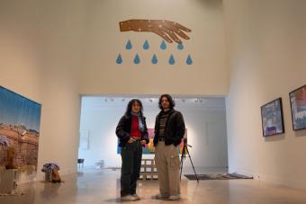 image of two people in an art gallery