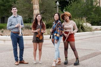 A group portrait of students holding their instruments