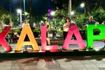 People standing by huge letters spelling XALAPA