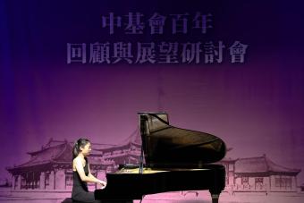Claire Chiang playing piano on stage
