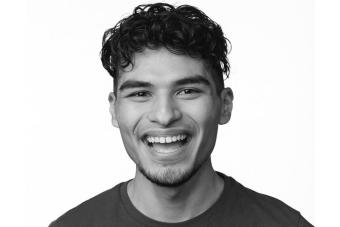 A black and white headshot of actor and director Andrew Rodriguez