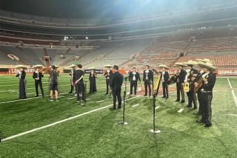 Mariachi Paredes performs with Portugal. The Man for a taped segment on the football field.