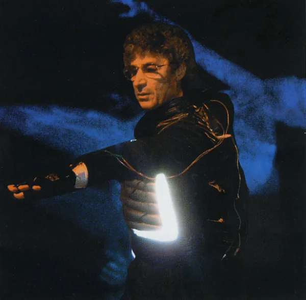 man dancing in costume with lights