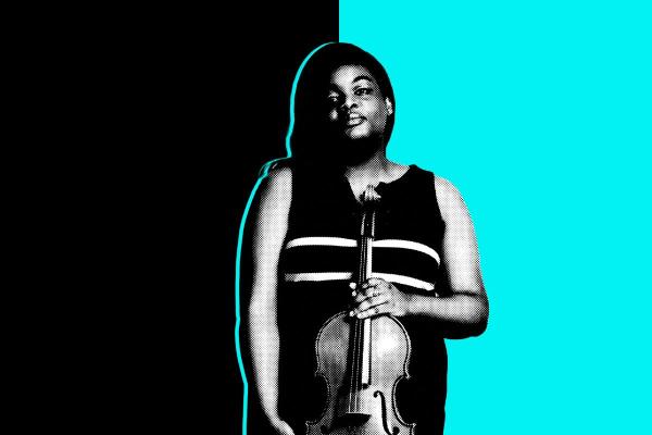 Black and white photo of a student holding a viola in front of a black and aqua background.