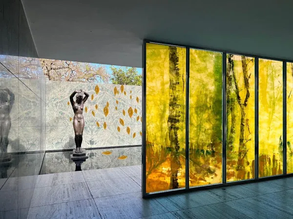 Sculpture in a partially indoor and partially outdoor space.