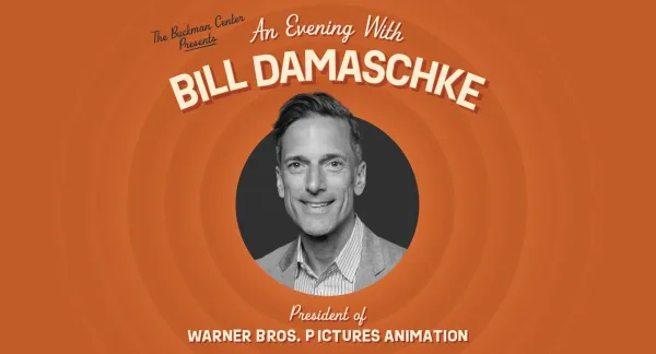 A promotional graphic with concentric orange rings features a black-and-white portrait of Bill Damaschke centered in a black circle. The text above reads “The Buckman Center Presents An Evening With BILL DAMASCHKE” and below reads “President of WARNER BROS. PICTURES ANIMATION.