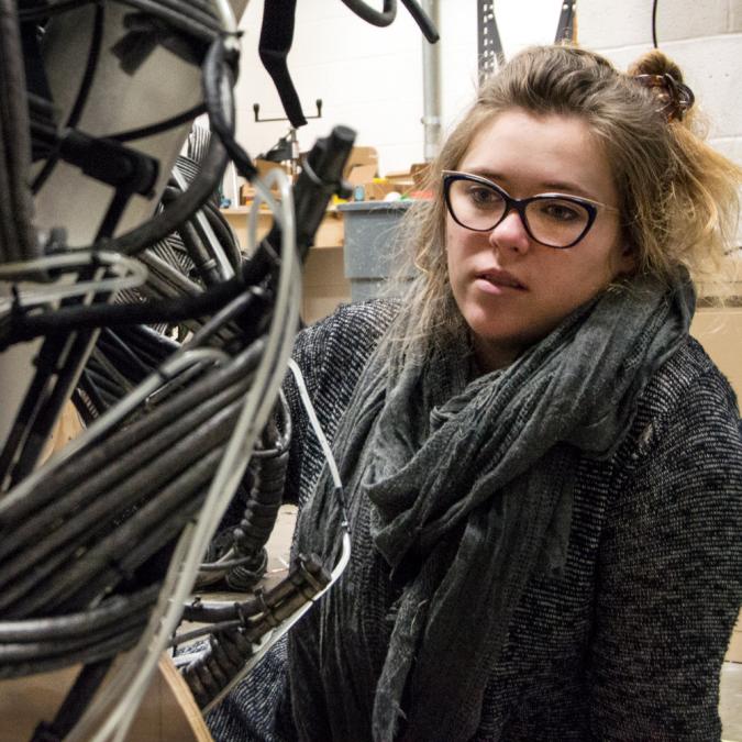 Ashton Bennett Murphy works on an animatronic raptor