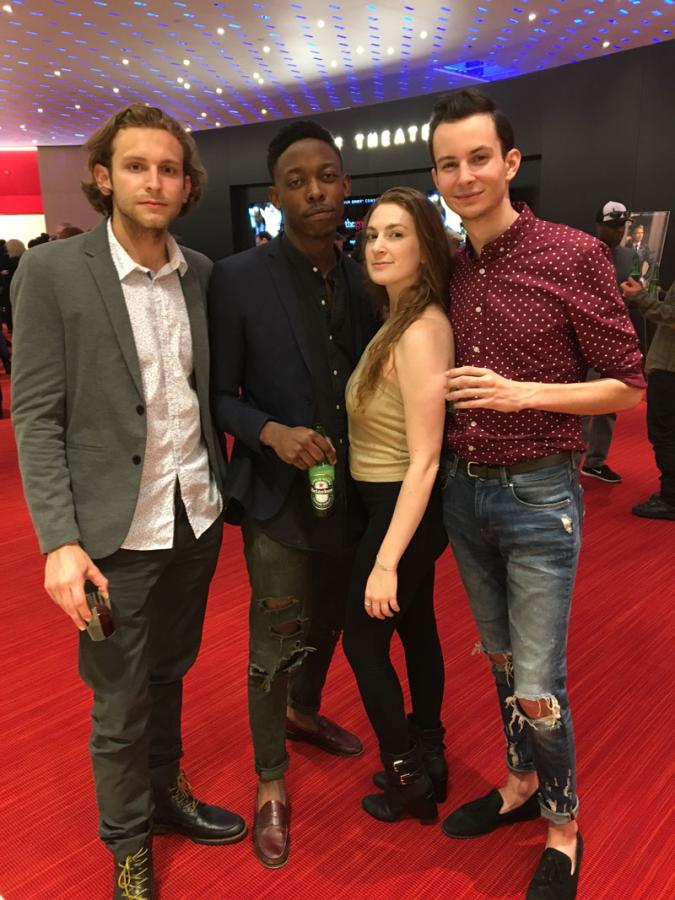 Four students stand outside of an LA theatre