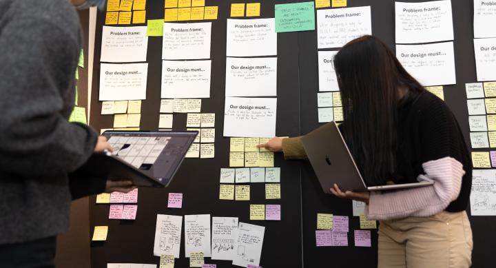 Students in the Center for Integrated Design present a project with lots of Post-its