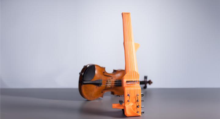 image of 3-D printed electric six-string violin and classical violin next each other