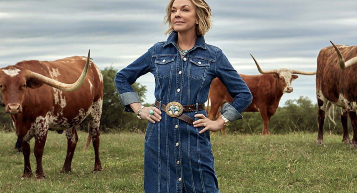 Gay Gaddis posing with longhorns