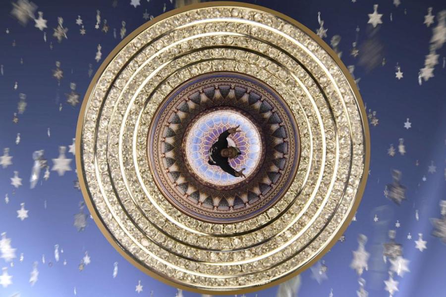 composite image: human figure seen from above in concentric gold circles against blue background