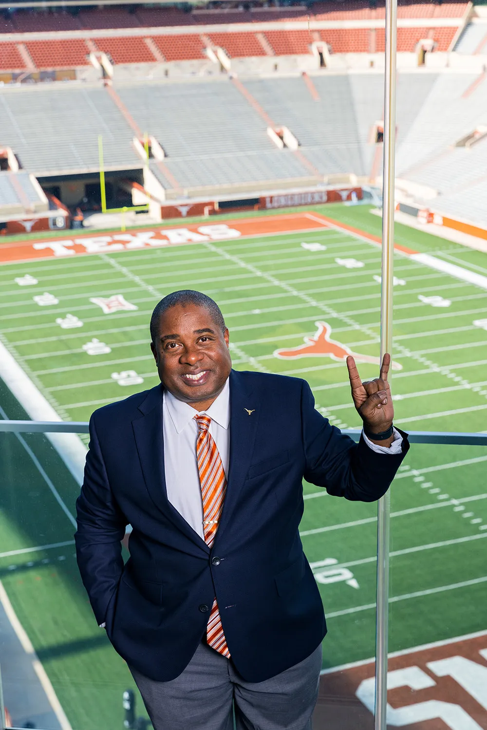 Portrait of Cliff Croomes in font of UT field