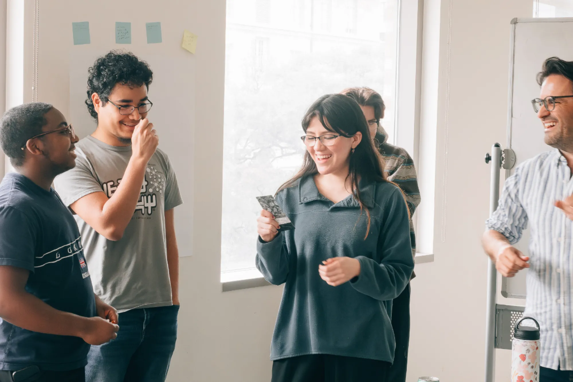 Students stand in a circle