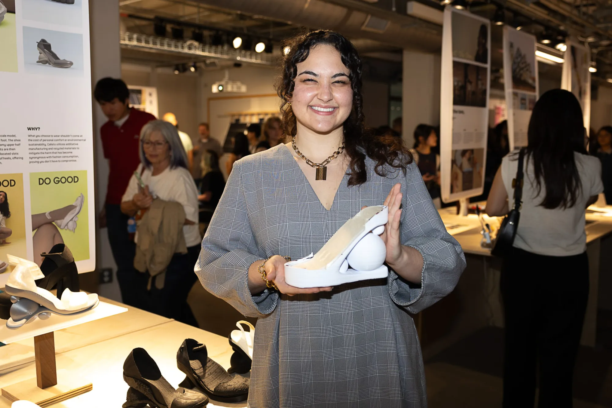 Design senior Ava Shea Feinstein holds a prototype of a sustainable shoe she designed.