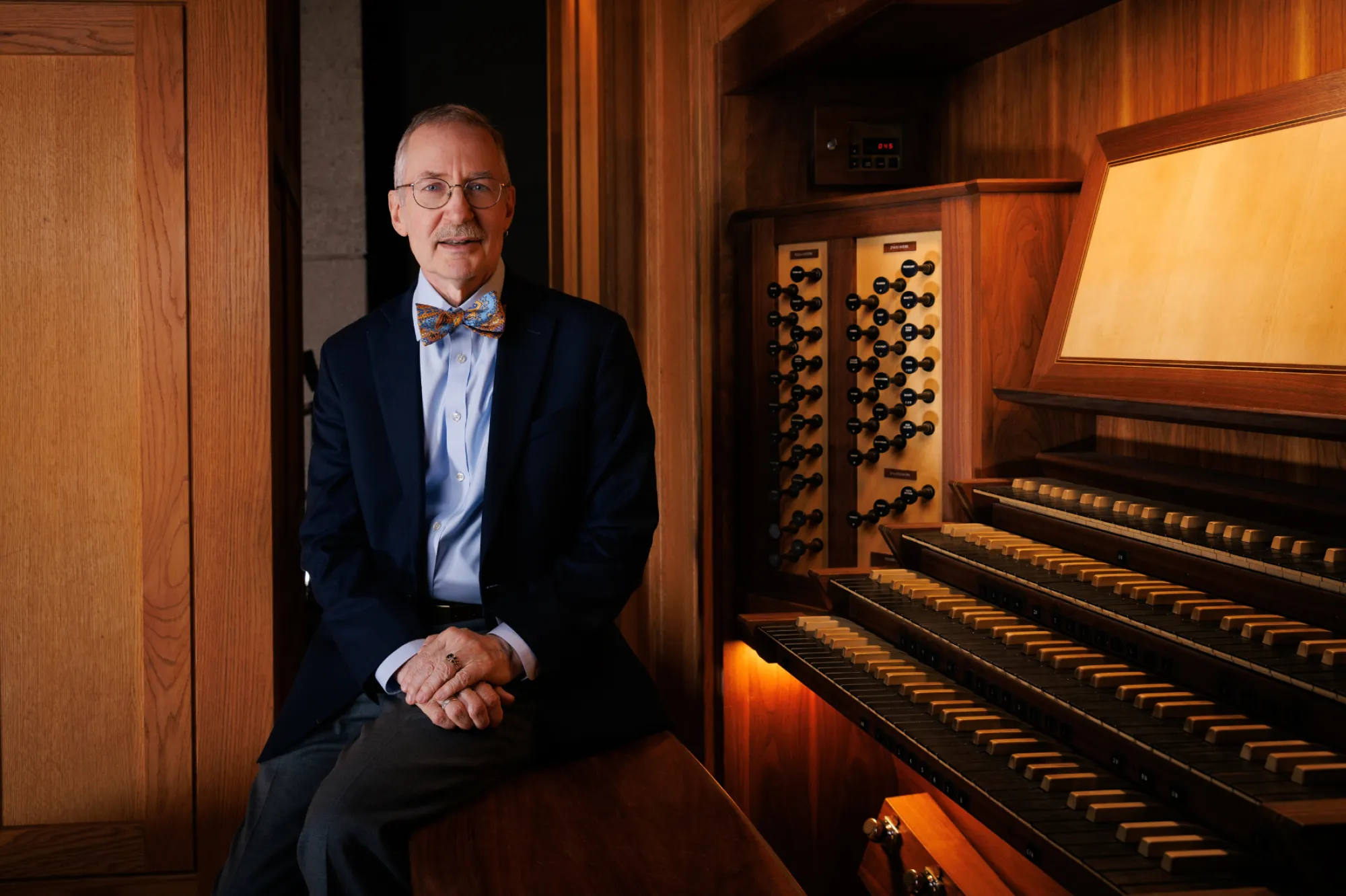 Gregory Eaton seated at Bates Pipe Organ