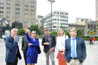 Associate Professor George Flaherty, center, gives a tour to Dean Dempster and Provost McInnis of the Palacio de Belles Artes in Mexico City.