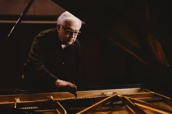 Charles Ball tunes a piano