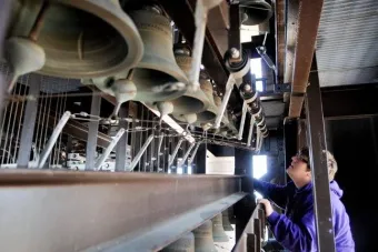 Austin Ferguson looking at a carillon