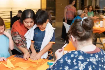 image of a family working on an art project together