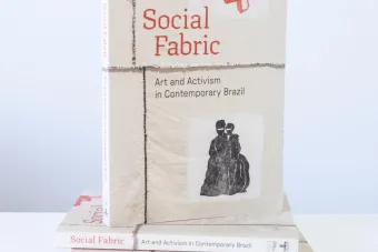 image of 3 social fabric books posed in front of a white wall