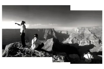 black and white image of two people at the Grand Canyon