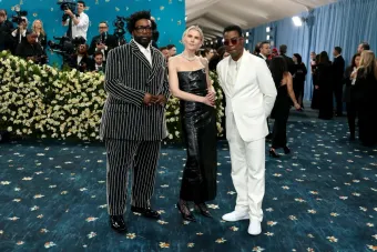 image of three people at the met gala