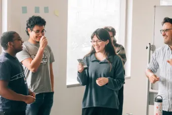 Students stand in a circle