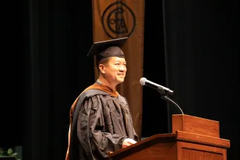 Alumnus and costume designer Steven Norman Lee addresses the Class of 2025