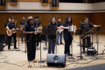 Conjunto ensemble playing on stage