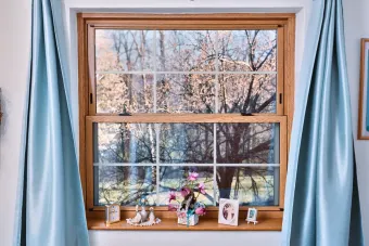 image of a window with blue curtains