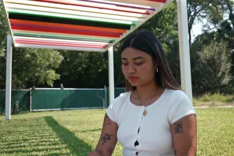 Stacy Nguyen sketches on the grounds of Laguna Gloria, where she interned for The Contemporary as part of the Arts Administration Fellowship program.