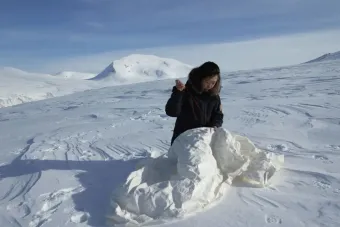 Beili Liu sewing in the arctic landscape